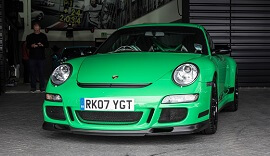 Green Porsche at Cars and Coffee event.