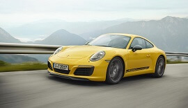 Yellow Lightweight Porsche 911 Carrera T on the road.