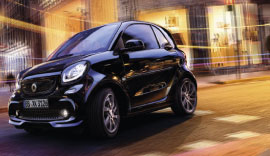 Black smart driving on the road.